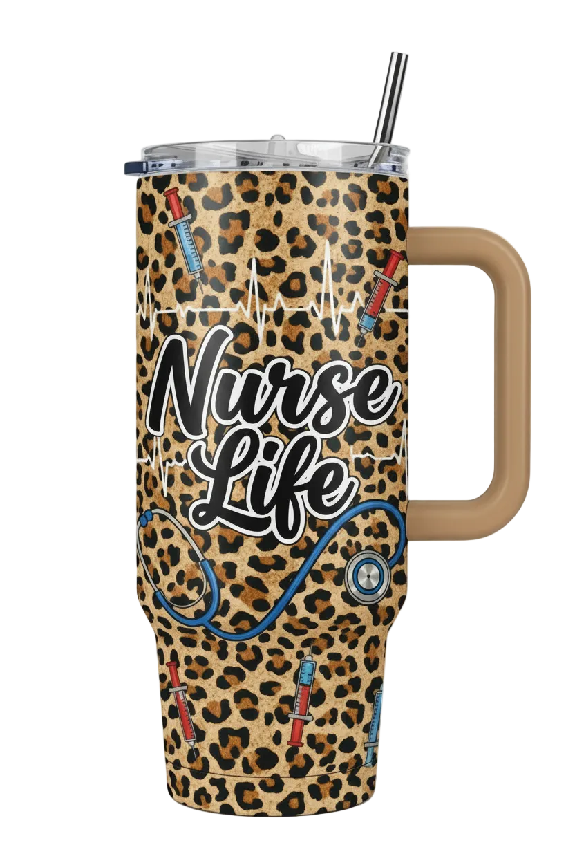 A 32oz insulated travel tumbler with a handle, featuring a leopard print design with 'Nurse Life' text, stethoscope, syringes, and EKG line graphics. It has a clear lid with a black-and-white striped straw.